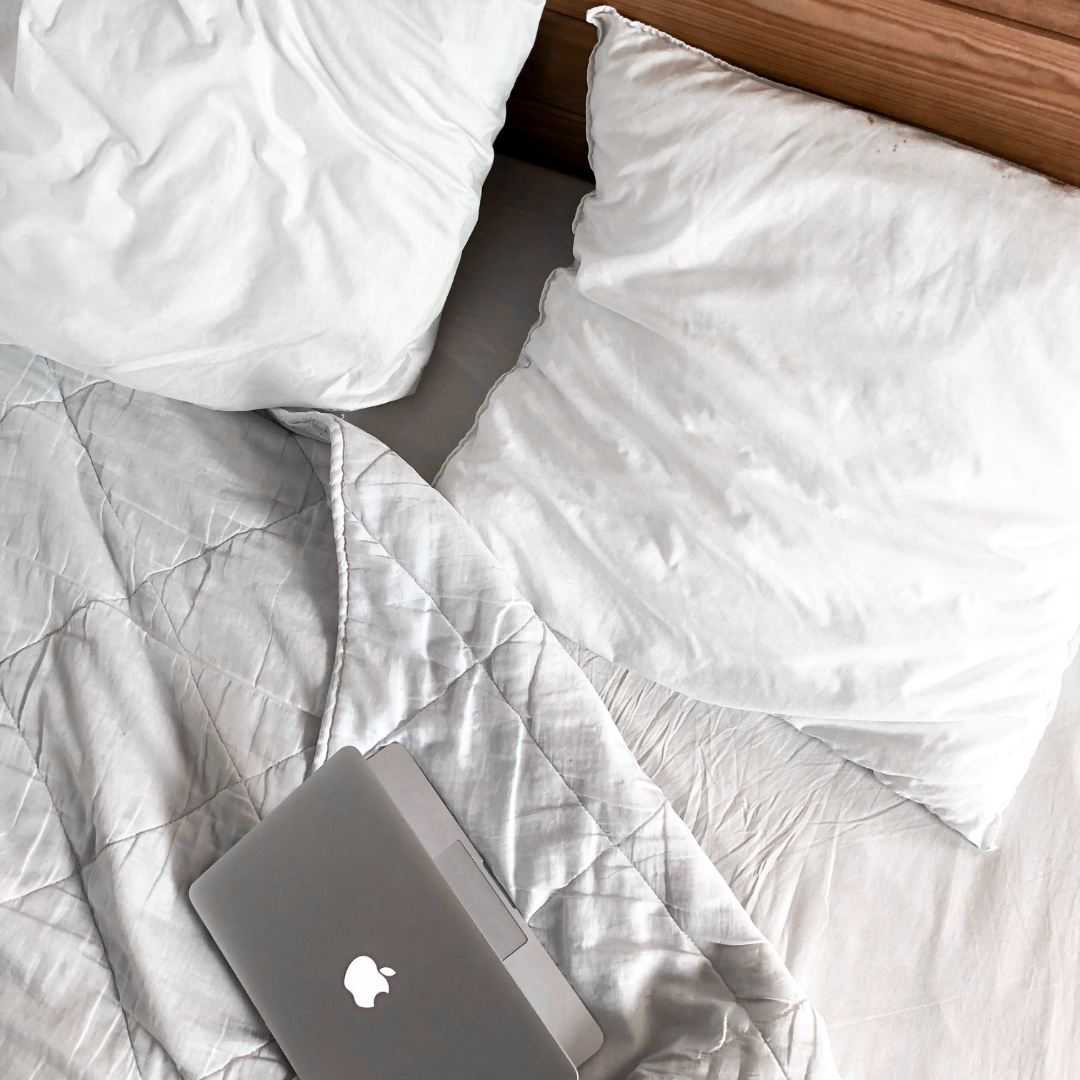 stock image, laptop on a bed